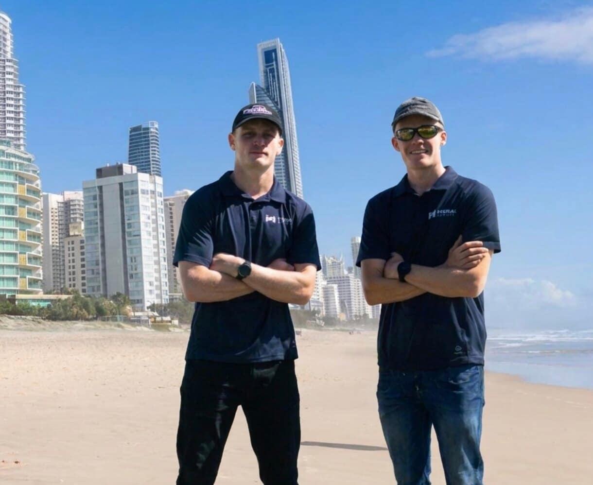Shaun and Justin, the two brothers behind Moral Service, on the beach at Surfers Paradise