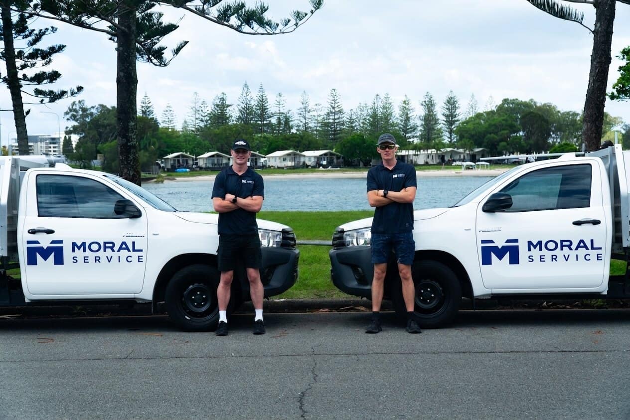 Shaun and Justin with the two branded Moral Service utes on the Gold Coast
