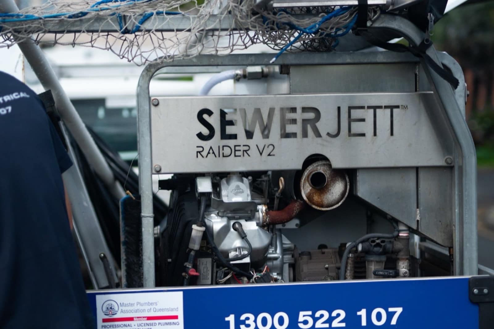 The Moral Service jet rodder on the back of the ute, with the MPAQ member badge and 1300 522 107 on the frame