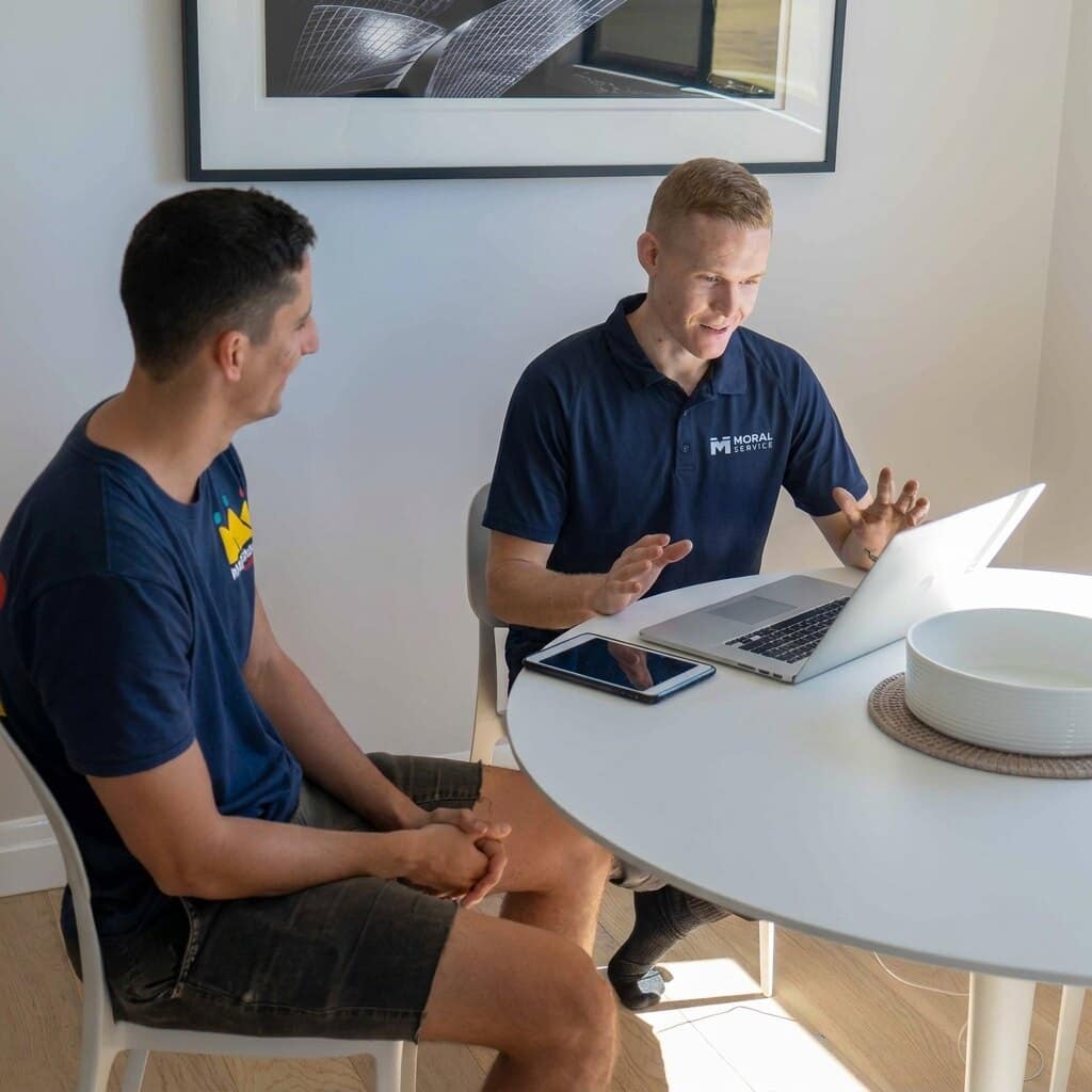 Moral Service talking a Gold Coast homeowner through the job at their kitchen table